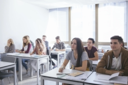 Students inside a classroom taking notes